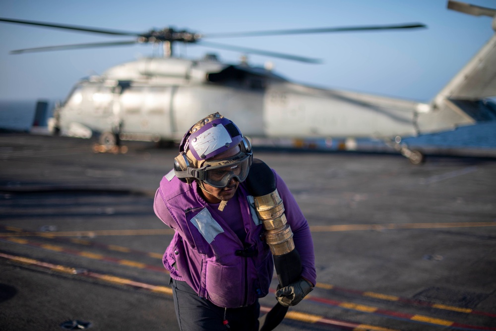 Sailor Moves A Hose