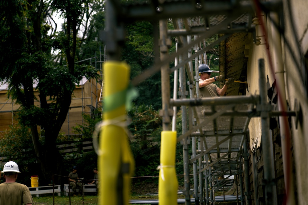 110th Wing Civil Engineers demo wall siding during Japan DFT