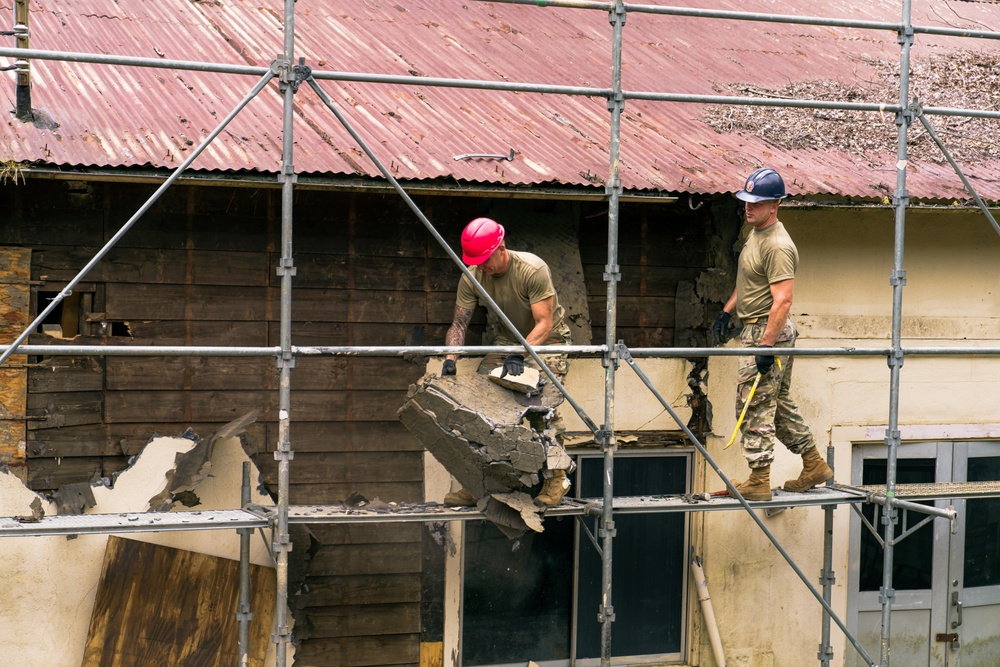 110th Wing Civil Engineers demo wall siding during Japan DFT