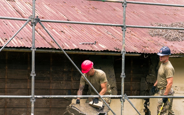 110th Wing Civil Engineers demo wall siding during Japan DFT