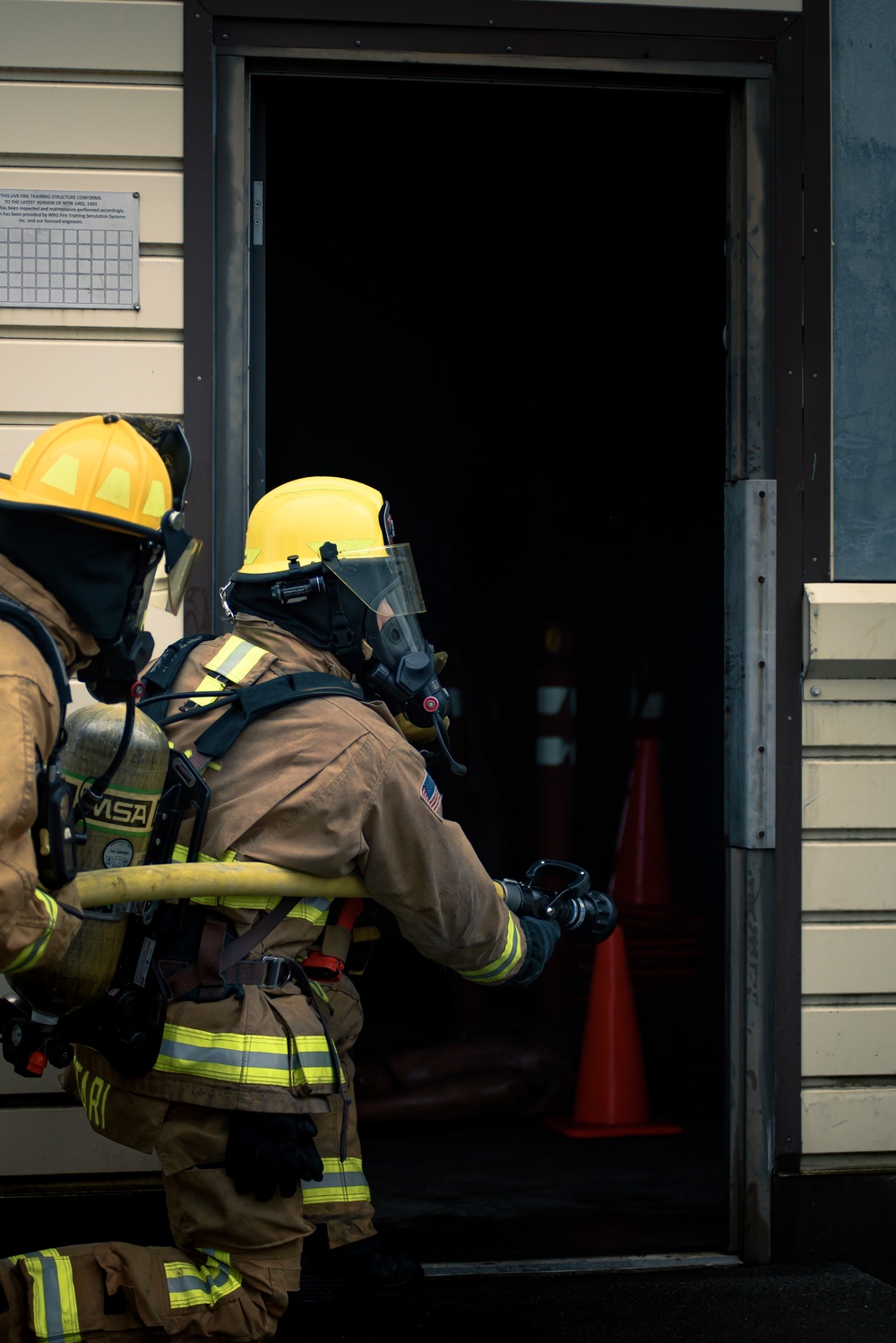 110th Wing Firefighters receive live building fire training during Japan DFT