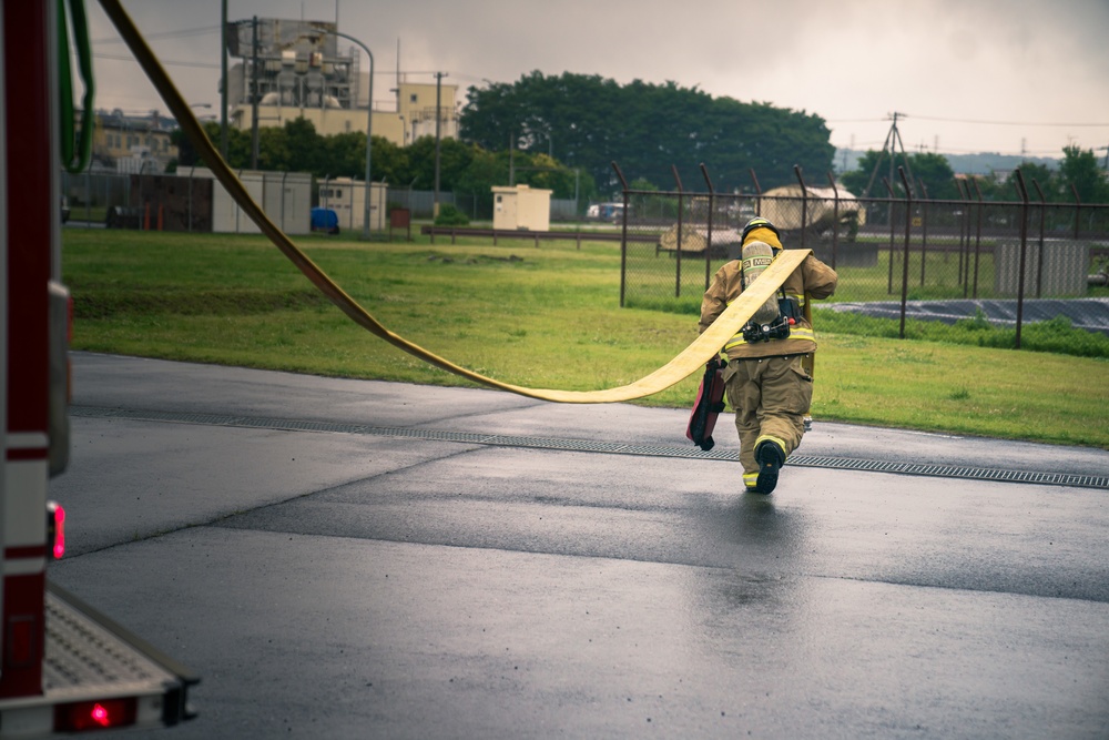 110th Wing Firefighters receive live building fire training during Japan DFT