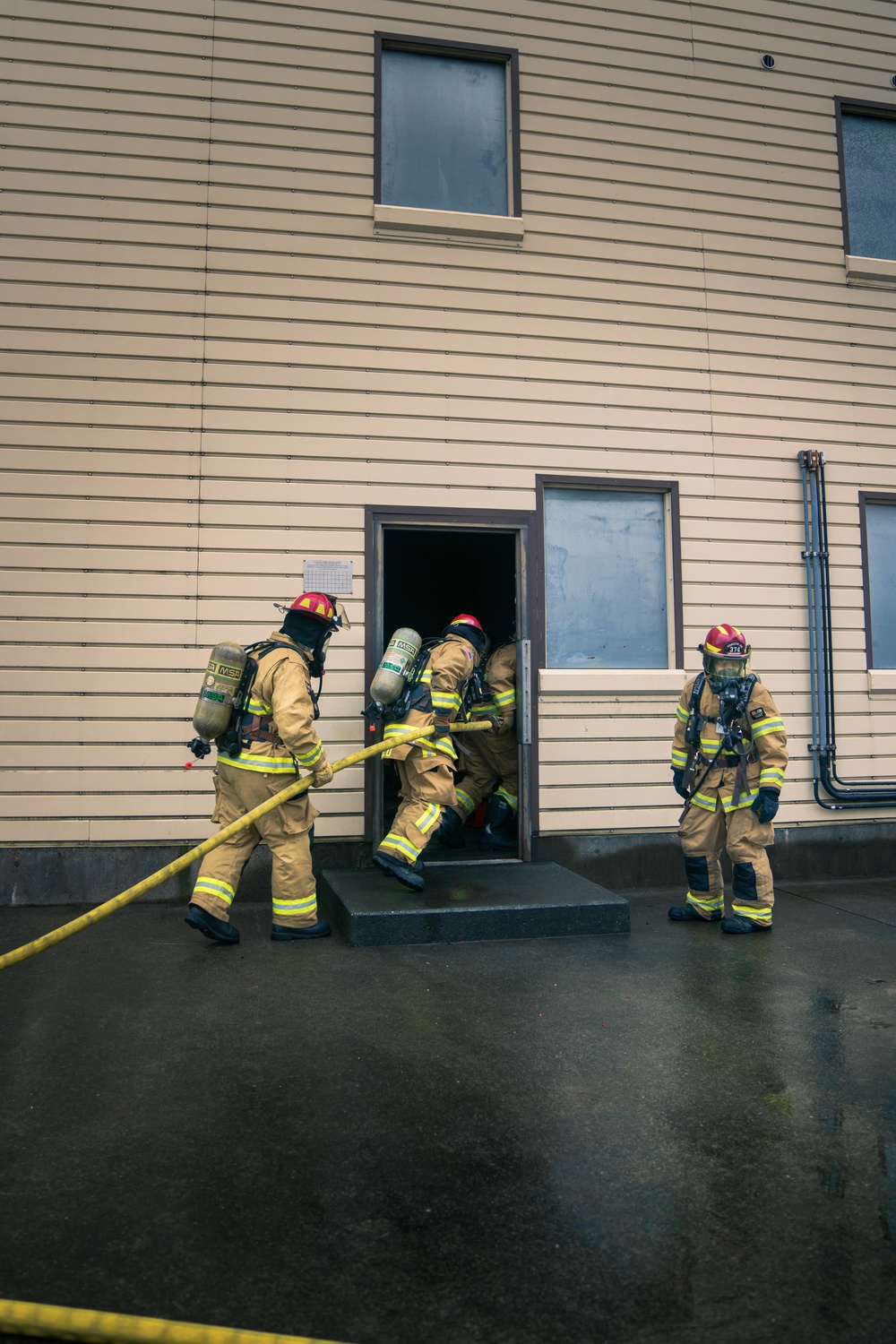 110th Wing Firefighters receive live building fire training during Japan DFT