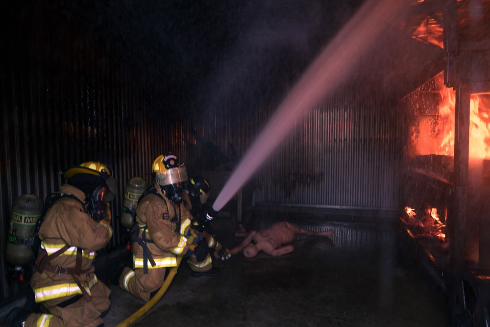 110th Wing Firefighters receive live building fire training during Japan DFT