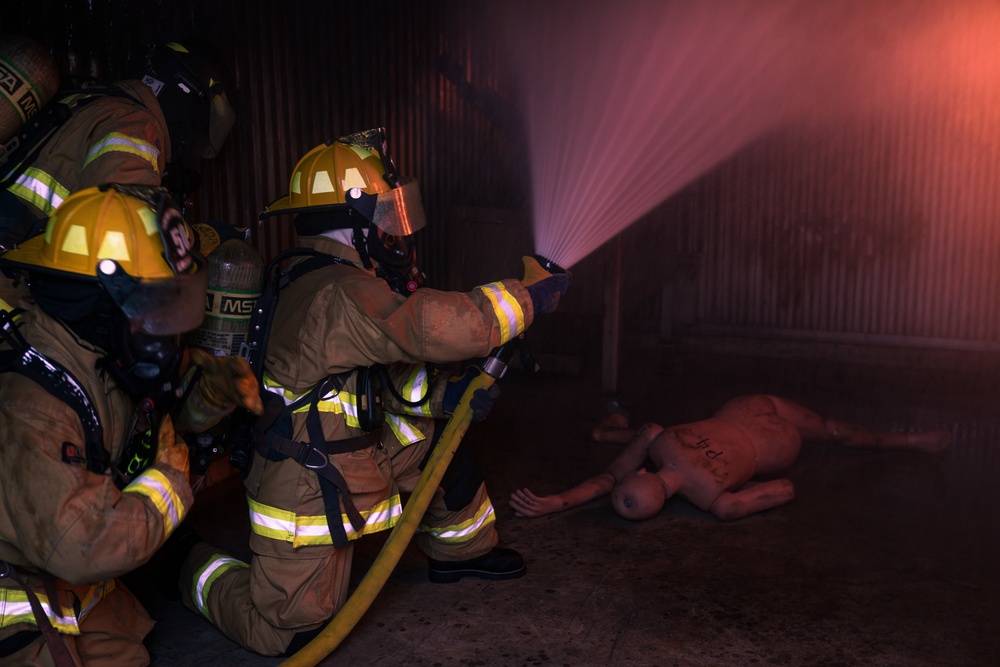 110th Wing Firefighters receive live building fire training during Japan DFT