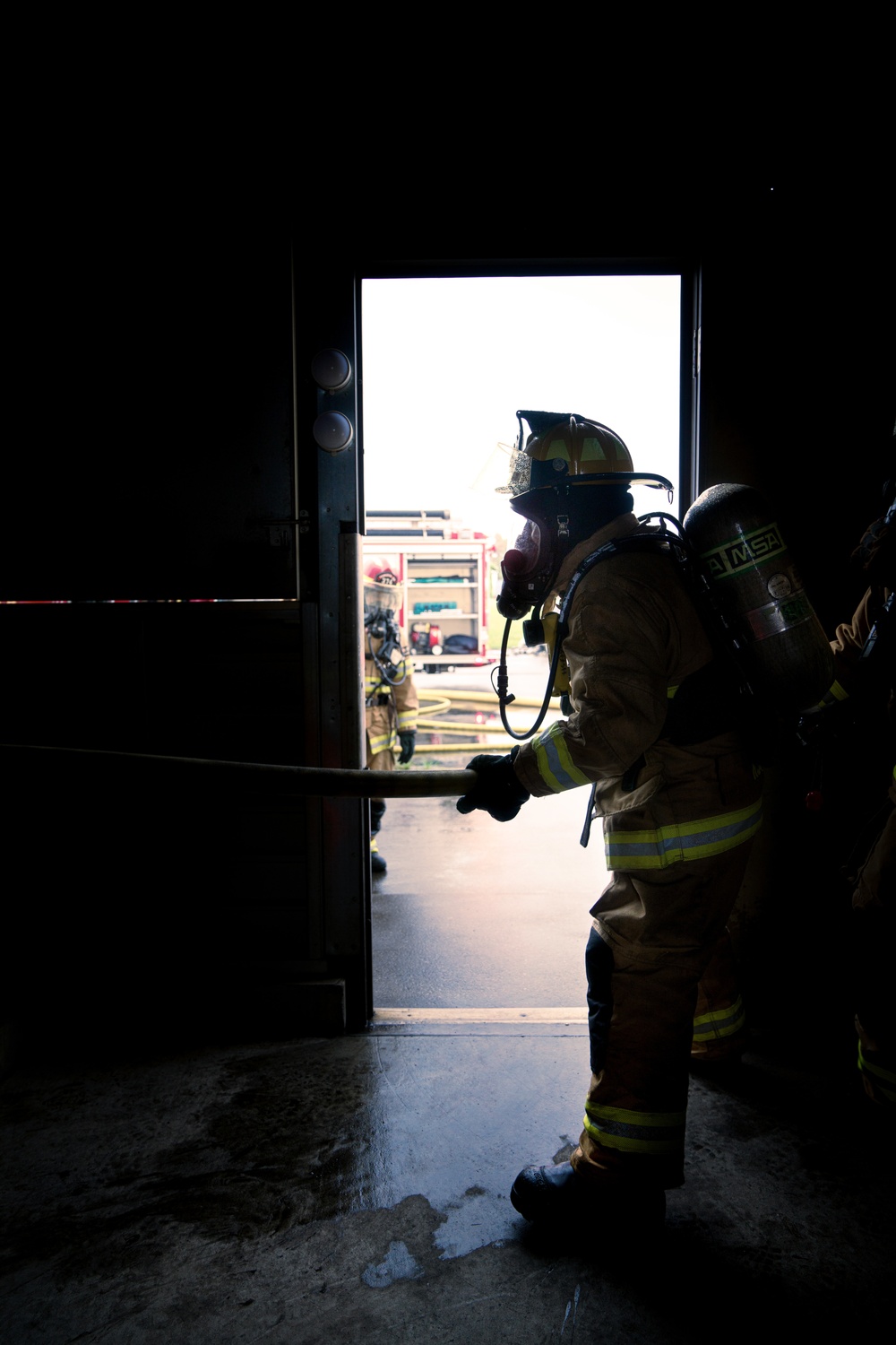 110th Wing Firefighters receive live building fire training during Japan DFT