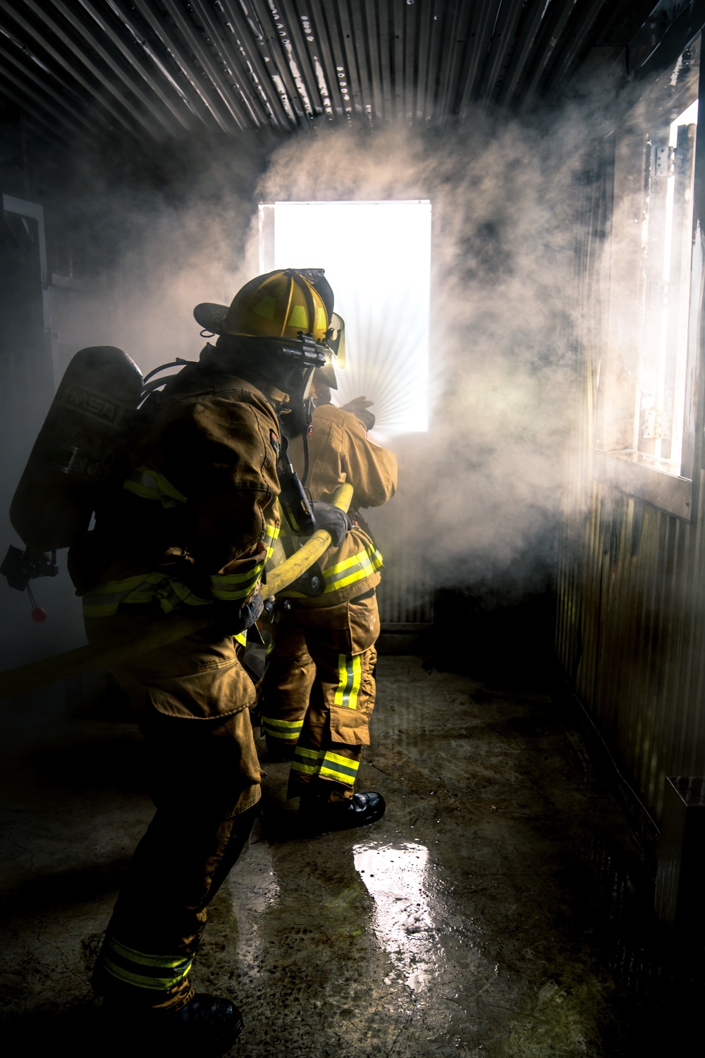 110th Wing Firefighters receive live building fire training during Japan DFT