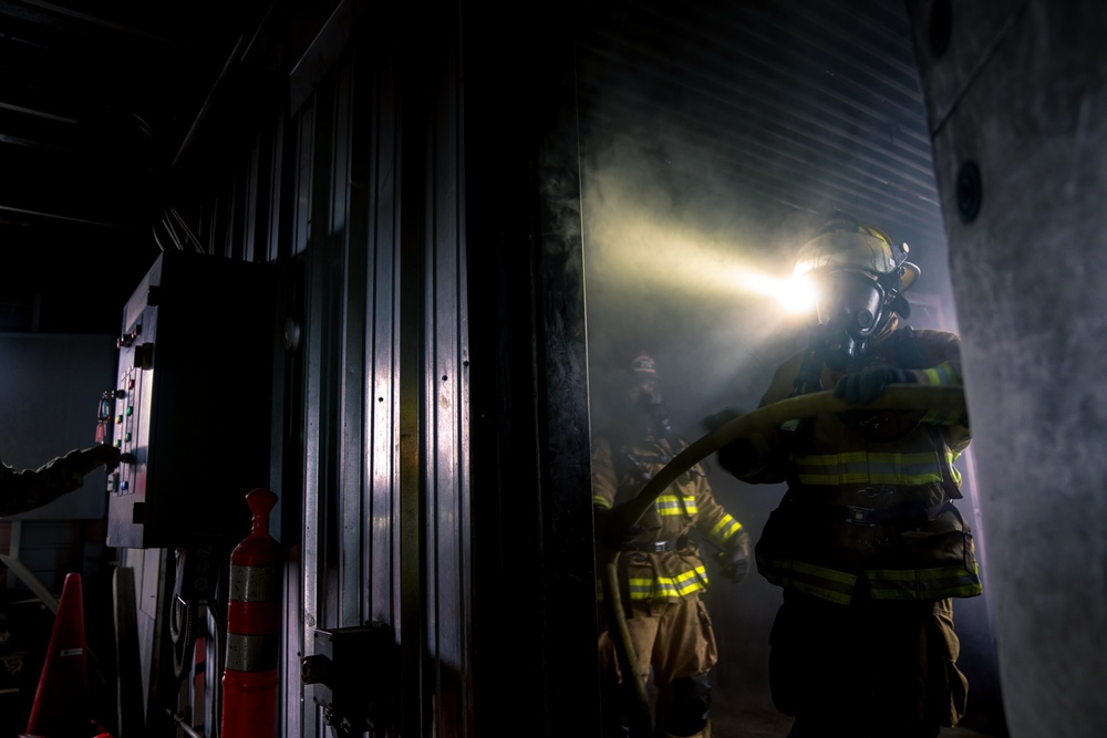 110th Wing Firefighters receive live building fire training during Japan DFT