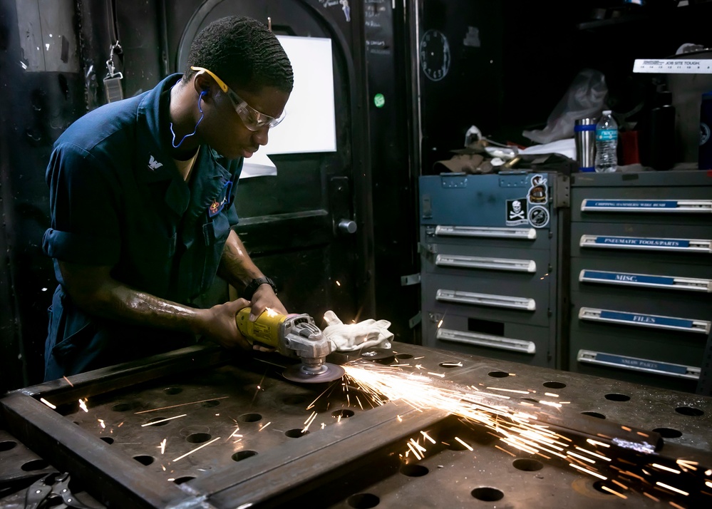 USS George H.W. Bush (CVN 77) Sailor Performs Maintenance