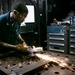 USS George H.W. Bush (CVN 77) Sailor Performs Maintenance