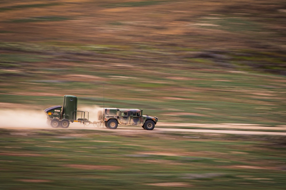 Soldiers transport a tactical toilet system during Western Strike 22