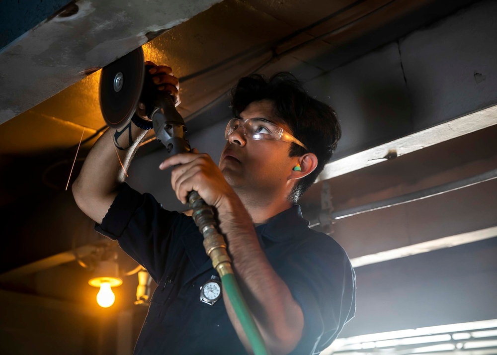 USS George H.W. Bush (CVN 77) Sailor Performs Maintenance