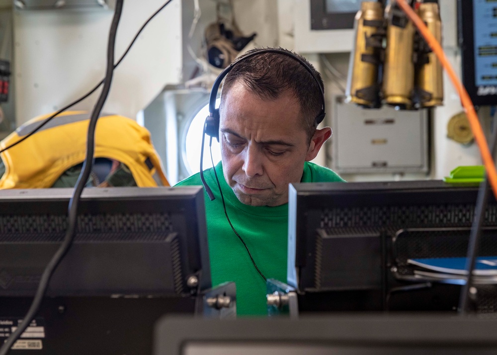 USS George H.W. Bush (CVN 77) Handler Mans Flight Deck Control