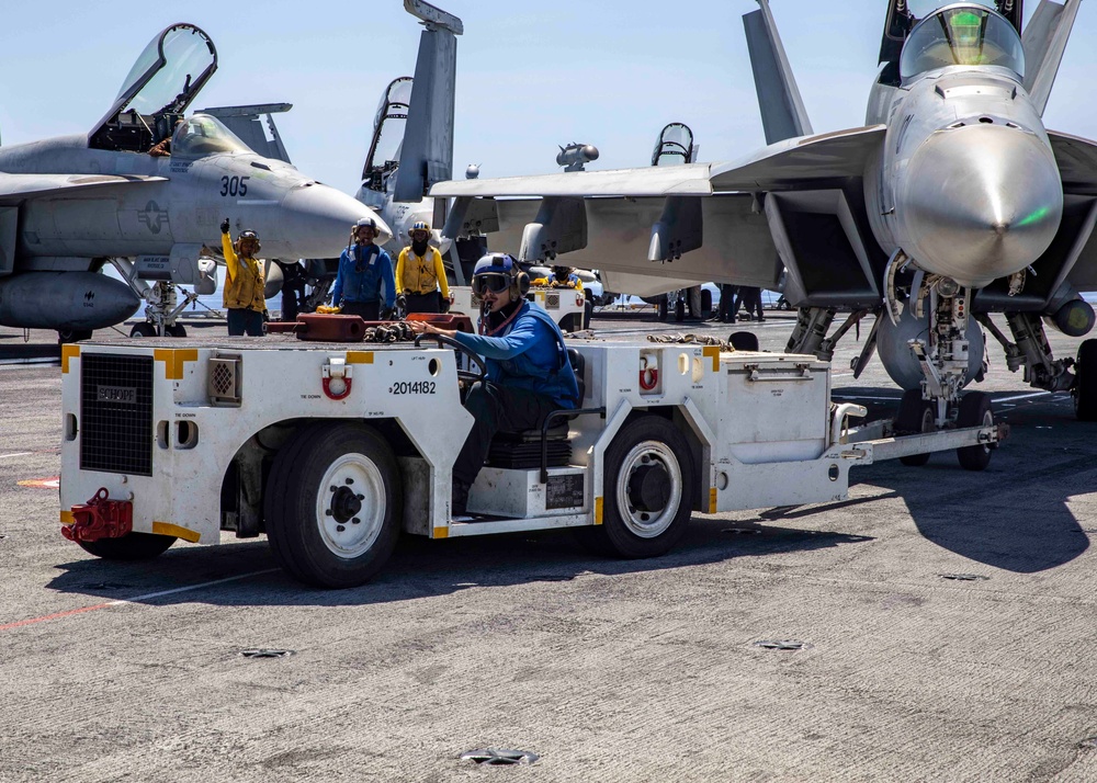 USS George H.W. Bush (CVN 77) Sailor Tows Aircraft