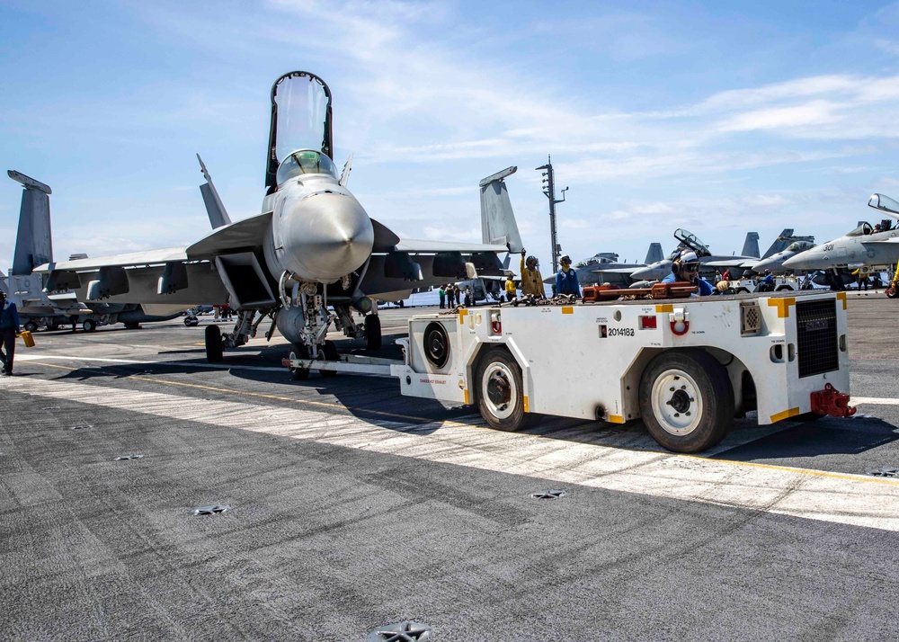 USS George H.W. Bush (CVN 77) Sailor Tows Aircraft