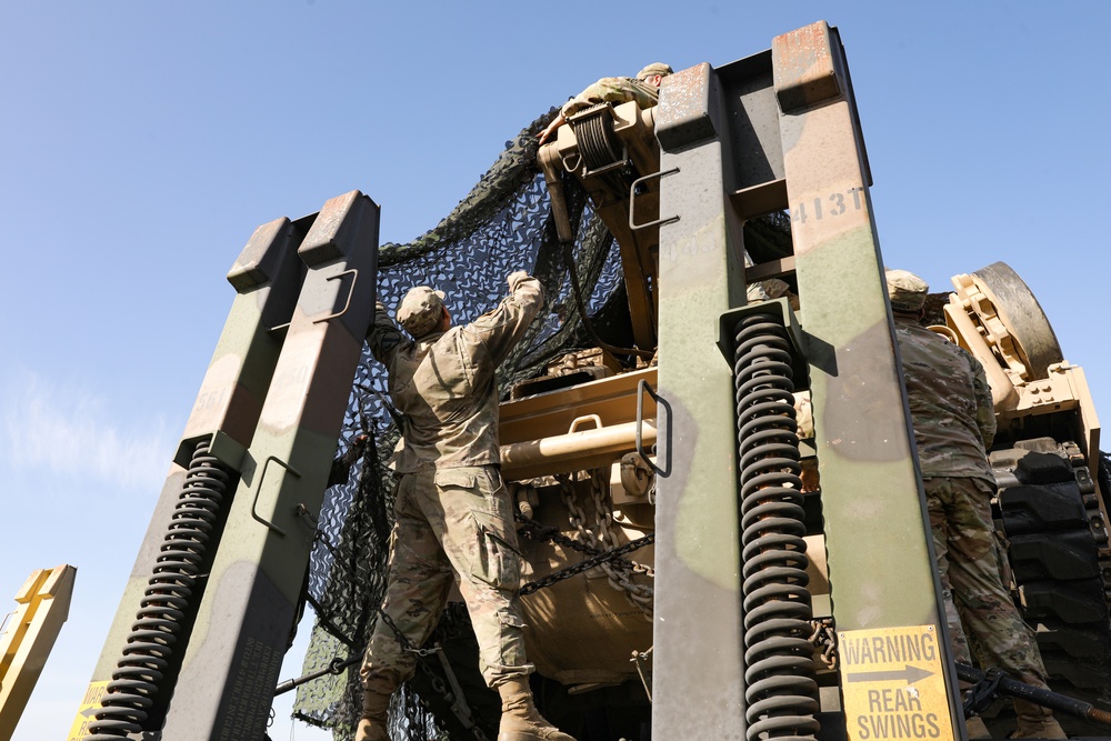 U.S. and Moroccan soldiers prepare equipment for transport to Tifnit, Morocco during African Lion 22