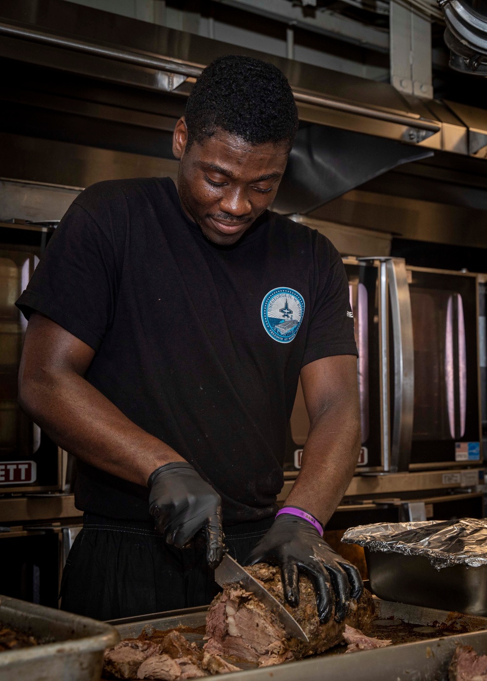 USS George H.W. Bush (CVN 77) Culinary Specialist Prepares Food for the Crew