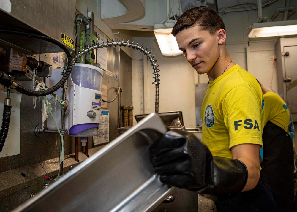 USS George H.W. Bush (CVN 77) Sailors Works in the Scullery