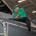 Strike Fighter Squadron (VFA) 143 Sailor Repairs Aircraft Aboard USS George H.W. Bush (CVN 77)