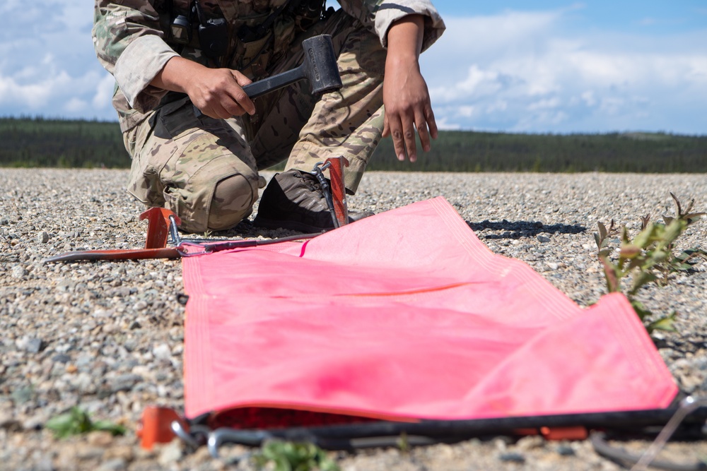 C-130s weave through mountains, perform dirt strip landings for RED FLAG 22-2