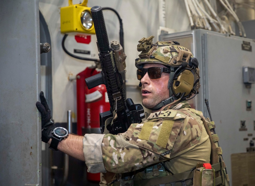 Sailors from USS Abraham Lincoln Conduct a Helicopter Visit, Board, Search and Seizure Exercise with USS Dewey