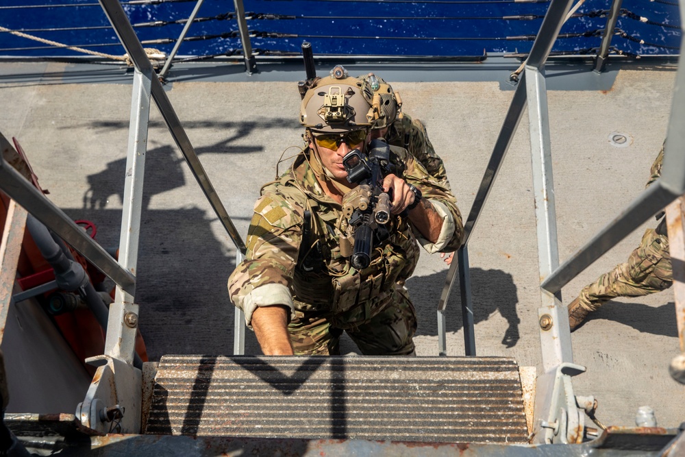 Sailors from USS Abraham Lincoln Conduct a Helicopter Visit, Board, Search and Seizure Exercise with USS Dewey