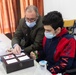 Abd Al Elah, left, is a Syrian refugee with disabilities and a handicraft instructor