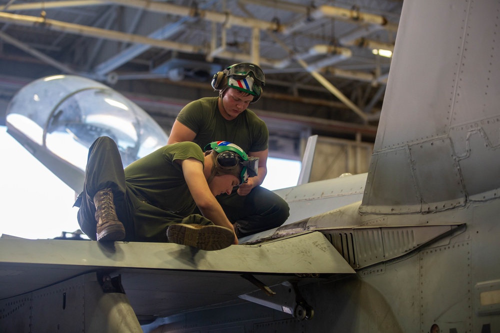 U.S. Marines with Marine Fighter Attack Squadron (VMFA)115 conduct maintenance