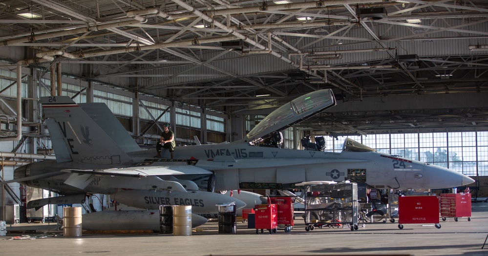 U.S. Marines with Marine Fighter Attack Squadron (VMFA)115 conduct maintenance