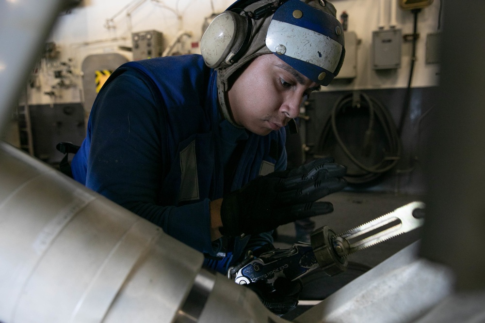 USS George H.W. Bush (CVN 77) Sailor Secures Aircraft