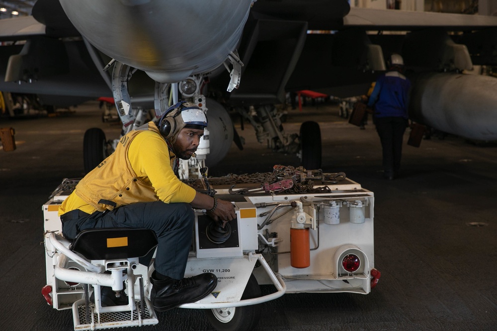 USS George H.W. Bush (CVN 77) Sailor Tows Aircraft