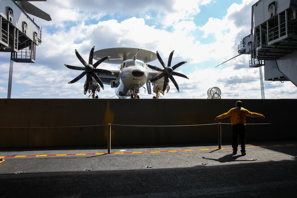 USS George H.W. Bush (CVN 77) Sailor Directs an Elevator