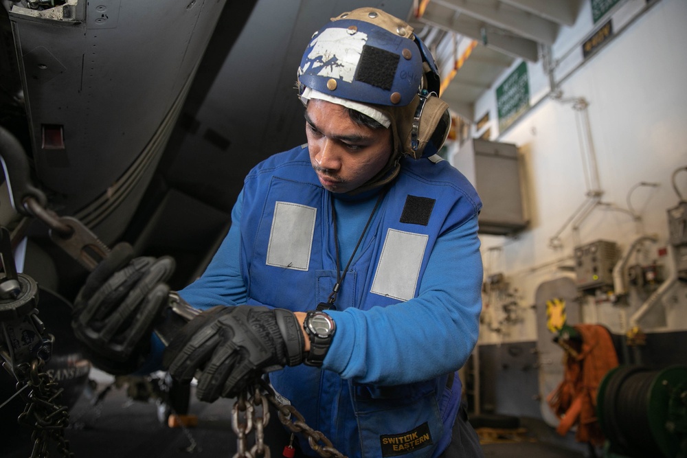 USS George H.W. Bush (CVN 77) Sailor Secures Aircraft