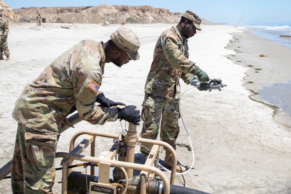 U.S. Army Reserve Soldiers prepare a raw water pump