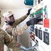 U.S. Army Reserve Soldiers inspect a reverse osmosis water purification unit