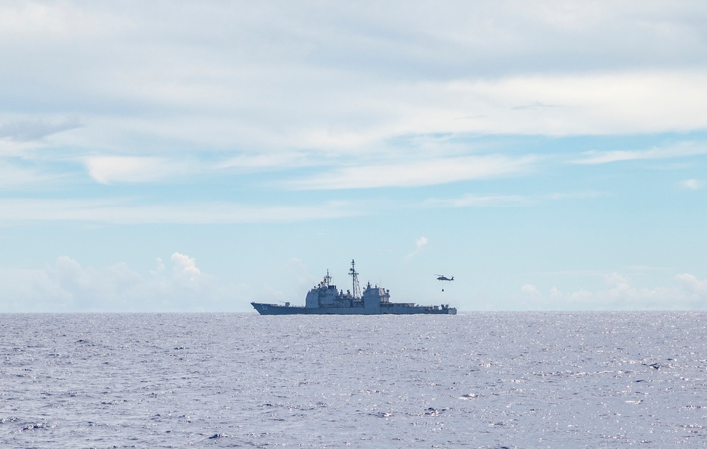 Sailors Aboard USS Dewey (DDg 105) Conduct Vertical Replenishment With USS Mobile Bay (CG 53)