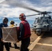 Sailors Aboard USS Dewey (DDg 105) Conduct Vertical Replenishment With USS Mobile Bay (CG 53)