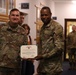 Col. James Brown is presented with The Meritorious Service Medal by Maj. Gen. James Smith