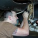 Abraham Lincoln Sailor conducts aircraft maintenance