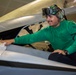 Abraham Lincoln Sailor conducts aircraft maintenance