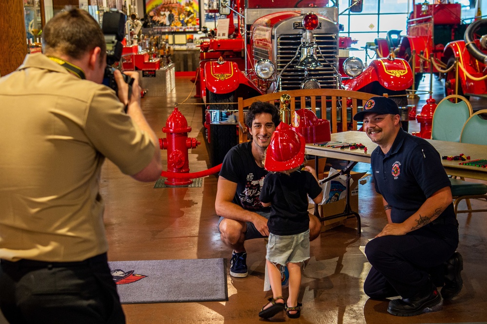 NSA Mid-South Fire Department speaks with families at The Fire Museum of Memphis during Navy Week Memphis