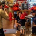 NSA Mid-South Fire Department speaks with families at The Fire Museum of Memphis during Navy Week Memphis