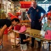 NSA Mid-South Fire Department speaks with families at The Fire Museum of Memphis during Navy Week Memphis