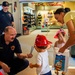 NSA Mid-South Fire Department speaks with families at The Fire Museum of Memphis during Navy Week Memphis