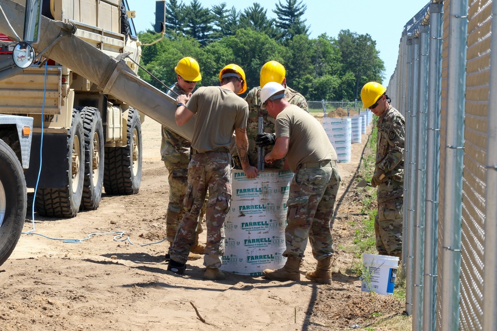 Engineers Install Light Poles at Fort McCoy