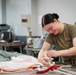 1 SOSS aircrew flight equipment specialists pack life-saving parachutes