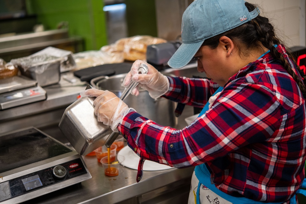 Competitors go plate to plate in food competition