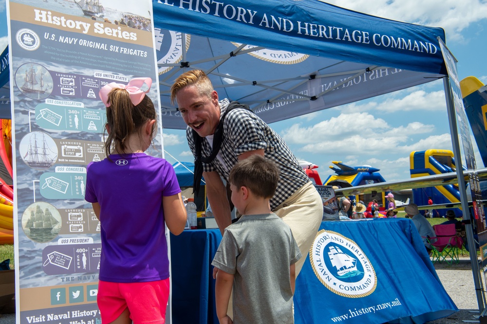 USS Constitution Sailor talks to kids about the history of the Navy at the Midsouth Airshow during Navy Week Memphis