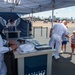 Sailors assigned to Navy Talent Acquisition Group (NTAG) Nashville and Talent Acquisition Onboarding Center (TAOC) Music City, talk to families about the Navy at the Midsouth Airshow during Navy Week Memphis