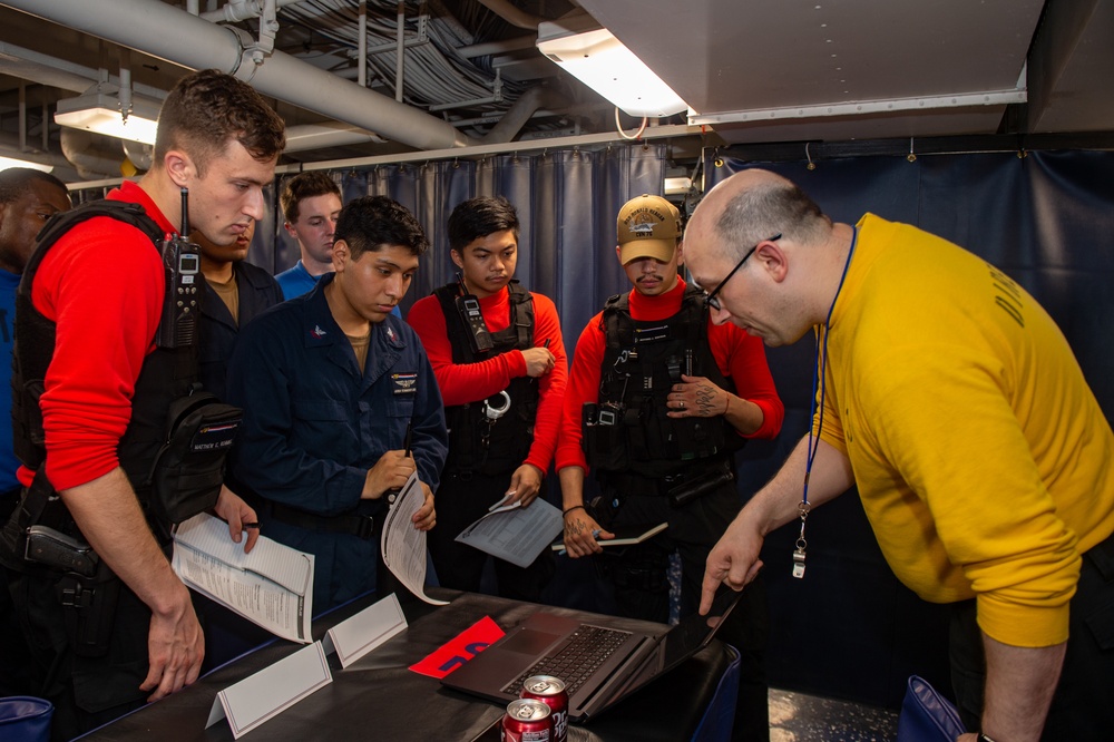 USS Ronald Reagan (CVN 76); holds financial fair